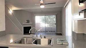 Living room and stairs from kitchen